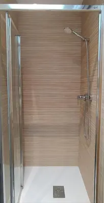 a shower with a shower head in a bathroom at Descubre Foz con nosotros in Foz