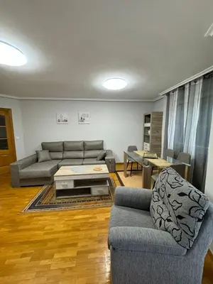 a living room with a couch and a table at Paseo del río in Ponferrada