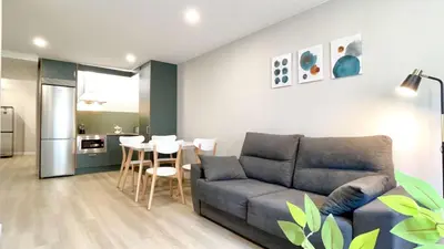 a living room with a couch and a table at The Cliffs - AT Seiramar Sacido in Viveiro