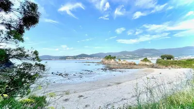 a beach with a view of the ocean at The Cliffs - AT Seiramar Os Castelos in Viveiro