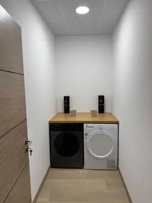 a laundry room with a washer and dryer at Apartamentos Turisticos Peregrin Palas in Palas de Rei