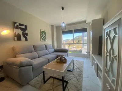 a living room with a couch and a table at Adeline in Caldas de Reis