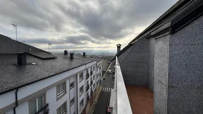 a view of a city from the balcony of a building at A Cuarta Ronda II in Melide