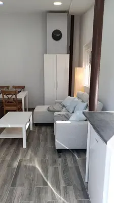 a living room with a couch and a table at Tu Escapada a Coruña in Guísamo