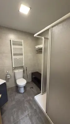 a bathroom with a toilet and a shower stall at apartamento TAHOCES 1 VUT-LE-1369 in Ponferrada