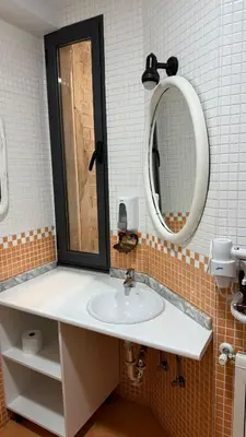 a bathroom with a sink and a mirror at apartamento TAHOCES 1 VUT-LE-1369 in Ponferrada