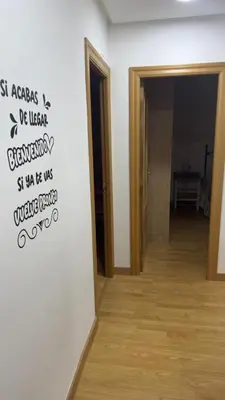 a room with a wall with the words st aches be veganeryery st at apartamento TAHOCES 1 VUT-LE-1369 in Ponferrada