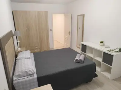 a bedroom with a bed with two slippers on it at Montirón 113 - Fontiñas in Lugo
