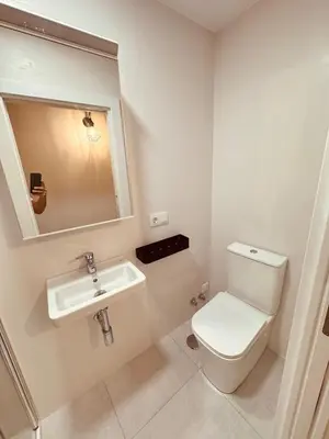 a bathroom with a toilet and a sink at Casa a Xanela Azul in Celanova