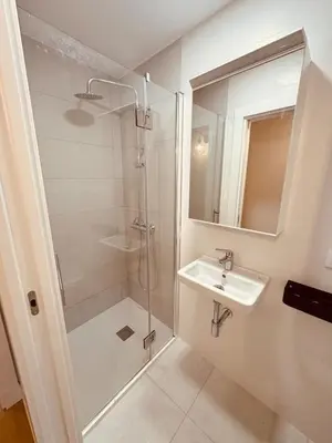 a bathroom with a shower and a sink at Casa a Xanela Azul in Celanova
