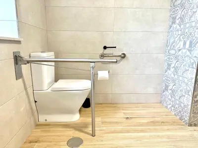 a bathroom with a toilet and a shower at Apartamentos Casa Courego in Vegadeo