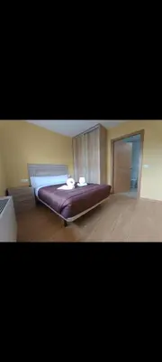 a bedroom with a large bed in a room at Pensión Palomos in San Xoán de Río