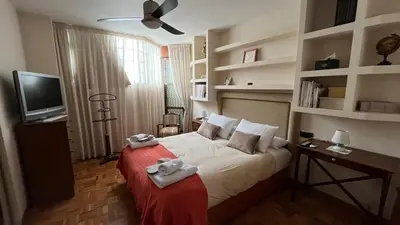 a bedroom with a bed with towels on it at Nice apartment overlooking Ponferrada Castle in Ponferrada