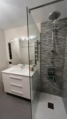 a bathroom with a sink and a shower at Nice apartment overlooking Ponferrada Castle in Ponferrada