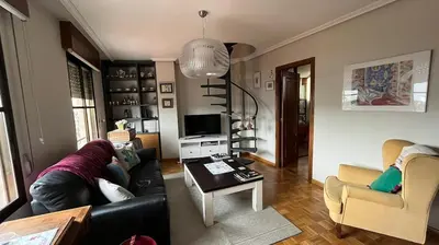 a living room with a couch and a table at Nice apartment overlooking Ponferrada Castle in Ponferrada