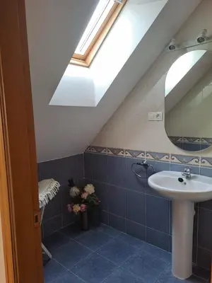 a bathroom with a sink and a skylight at Arca de Noé in Valle de Oro
