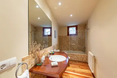 a bathroom with a sink and a shower at Casa Doña Blanca, Ourense in San Clodio