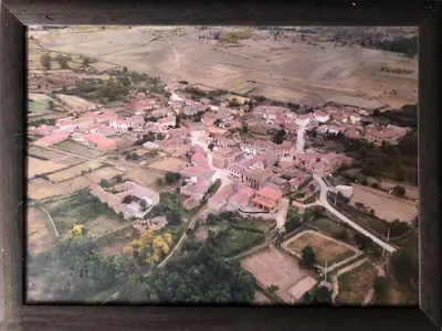 a painting of a small town with houses at Mis antepasados in Murias de Pedredo