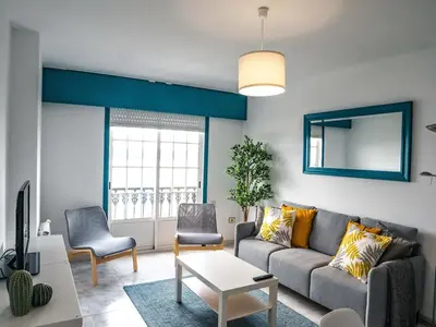 a living room with a couch and two chairs at Apartamento O Cobo Miño in Miño