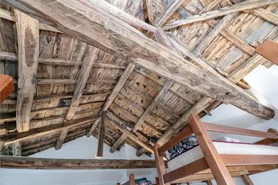 a wooden ceiling in a room with wooden beams at Casa de montaña - A Palleira do Curralón in Pradoalvar
