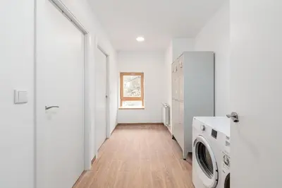 a white laundry room with a washer and dryer at Casa de montaña - A Palleira do Curralón in Pradoalvar