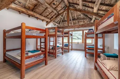 a room with a bunch of bunk beds at Casa de montaña - A Palleira do Curralón in Pradoalvar