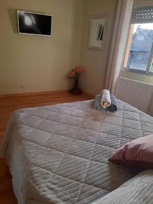 a large bed in a room with a large bed at Casa Daló II in Folgoso