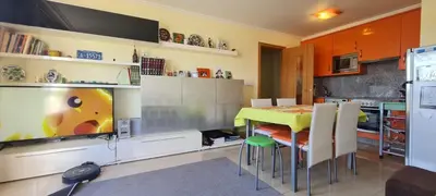 a kitchen with a table and a yellow table and chairs at Ribeiras do Tamega in Verín