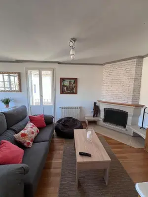 a living room with a couch and a coffee table at Casa la Plaza in Molinaseca