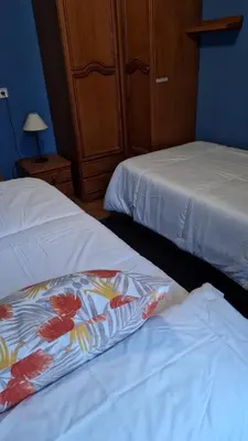 two beds sitting next to each other in a room at Casa la Plaza in Molinaseca