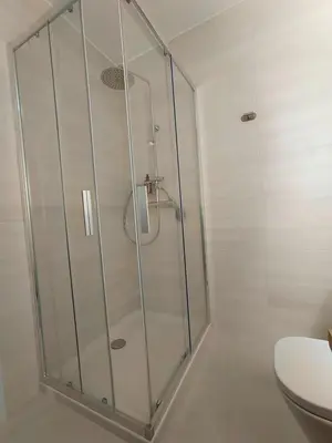 a shower stall in a bathroom with a toilet at Casa Rectoral de Rante in Rante