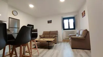 a living room with a table and a couch and chairs at Casa Rectoral de Rante in Rante