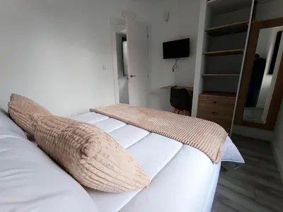 a white bed with two pillows on top of it at Casa Rectoral de Rante in Rante