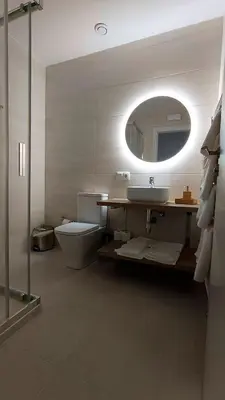 a bathroom with a sink and a toilet and a mirror at Casa Rectoral de Rante in Rante