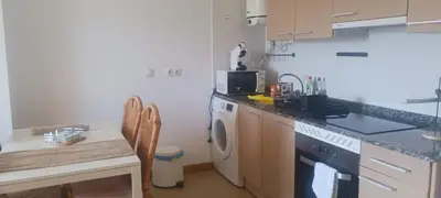 a kitchen with a sink and a washing machine at Alojamiento Turístico Santalla in Santa Eulalia de Oscos