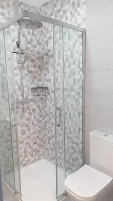 a shower stall with a toilet in a bathroom at Abacería in Allariz