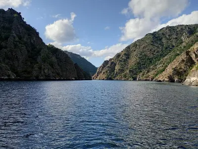 a view of a river between two mountains at A Feitiña de Rubiacós in Rubiacós