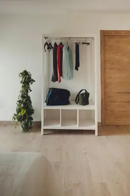 a room with a white shelf with clothes at La Molinera Casa Rural - Ribeira Sacra in Ourense