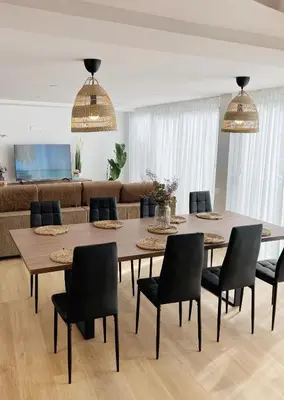 a dining room with a table and chairs at Gallaecia Dúplex in Arzúa