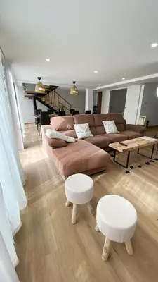 a living room with a couch and a table at Gallaecia Dúplex in Arzúa