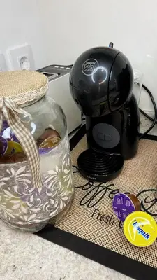 a tea pot and a glass jar on a counter at Gallaecia Dúplex in Arzúa