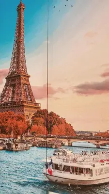 a boat in the water in front of the eiffel tower at Gallaecia Dúplex in Arzúa