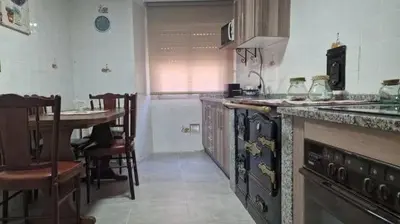 a kitchen with a counter and a table in it at Casa Engracia in Arcos