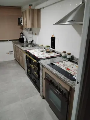 a kitchen with a stove and a sink at Casa Engracia in Arcos