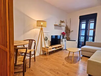 a living room with a table and a couch at YourHouse Ourense Bello 2 Loft in Ourense