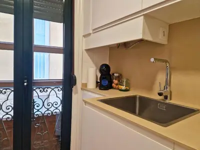 a living room with a couch and a tv at YourHouse Ourense Bello 2 Loft in Ourense