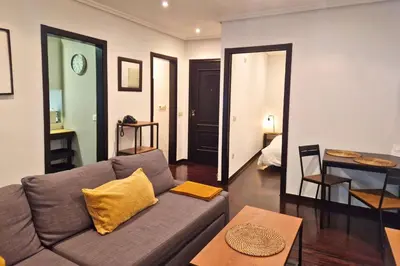 a living room with a couch and a table at YourHouse Ourense Bello 1 Loft in Ourense