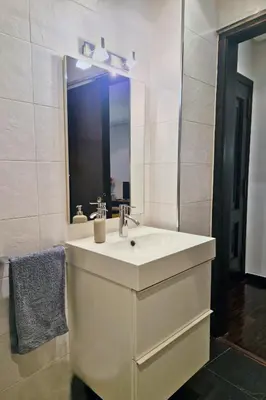 a white bathroom with a sink and a mirror at YourHouse Ourense Bello 1 Loft in Ourense