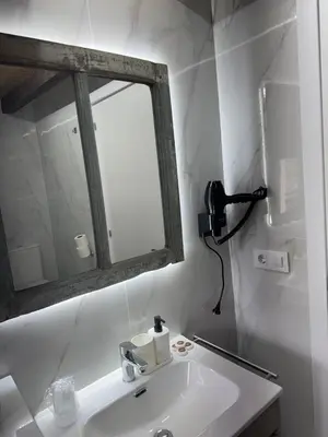 a bathroom with a sink and a mirror at Casa Lounge Xacobeo in Tríacastela