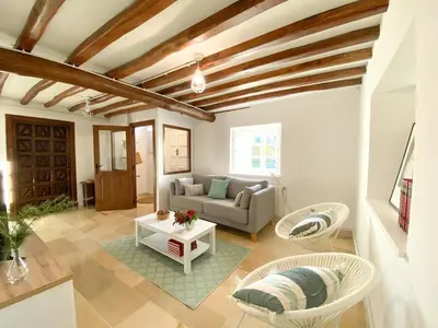 a living room with a couch and a table at Casa Pastur in Serantes